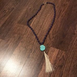 Beaded long necklace with charm